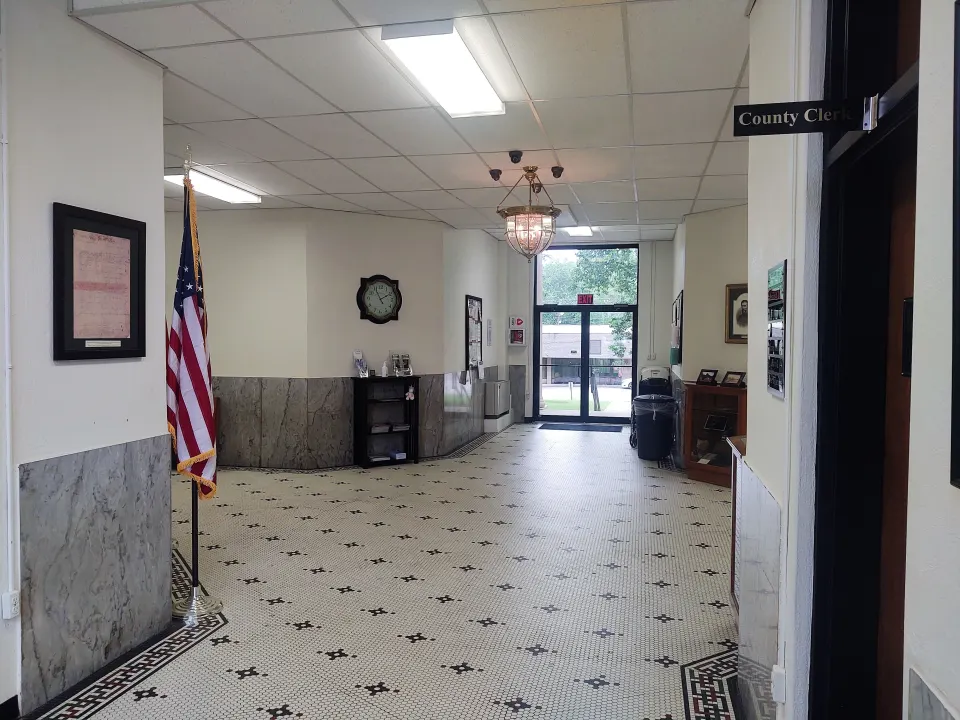 Lobby of a county courthouse with an American flag